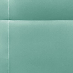 Fototapeta premium Textured teal paper background with copy space