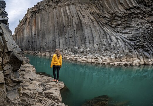 Tourist at Stu&eth;lagil Canyon, basalt columns, Egilsstadir, Iceland