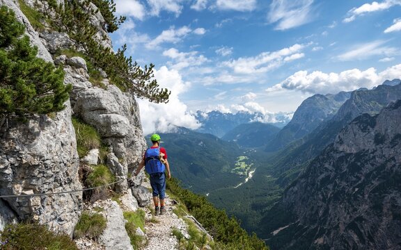 Young hiker, mountaineer on the Sentiero Carlo Minazio path, view of the Valle di San Vito, Sorapiss circuit, Dolomites, Belluno, Italy