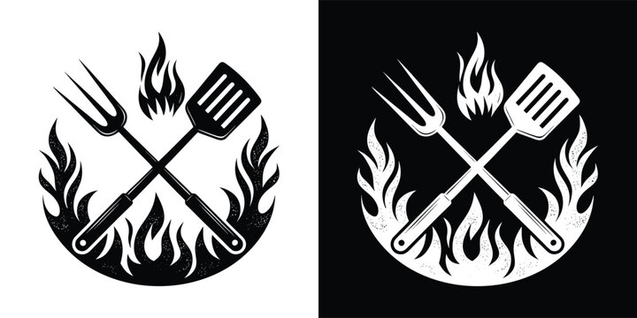 Crossed barbecue spatula and grill fork inside a hot flame