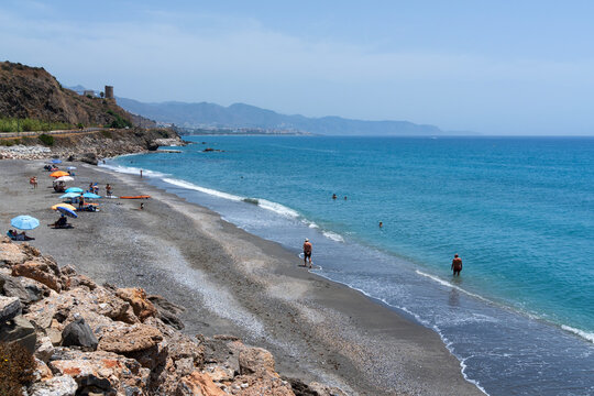 Waves rolling onto the beach, Playa de Calaceite, near Torrox Costa, Andalusia, Spain