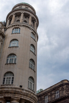 Historic building under a cloudy sky in an urban setting