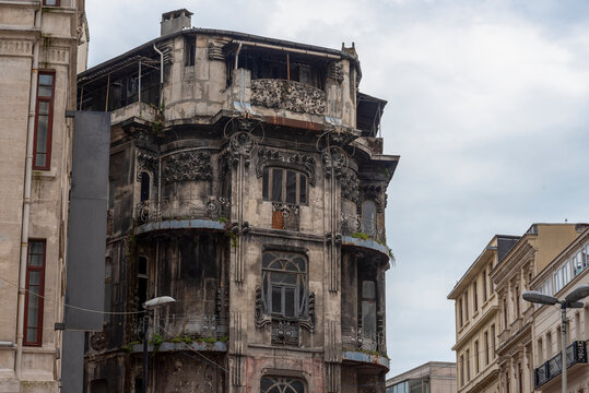 Abandoned building in the city shows faded architecture and signs of wear from years of neglect and exposure to weather