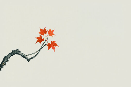 Bright red leaves on a thin branch against a light background in autumn season