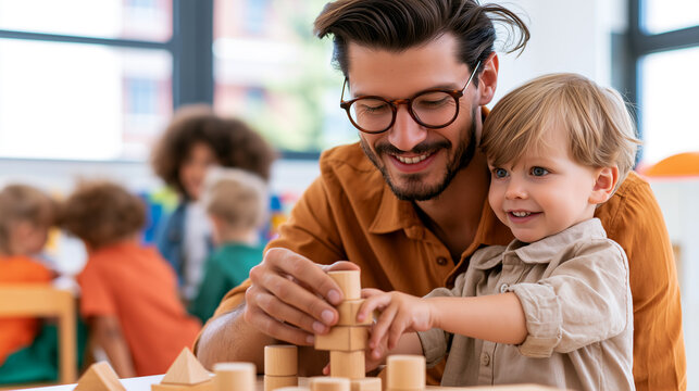 Kindergarten teacher guiding child stacking wooden blocks in bright classroom, playful learning and early education, childcare support, happy kid development, soft daylight, diverse group bokeh.