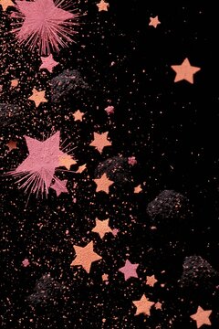 Colorful stars and sparkling dust scatter across a dark background creating a fun and playful scene during nighttime