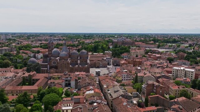 Aerial drone view of the Basilica of St. Anthony in Padua, Italy, showcasing the iconic domes, historic architecture, and surrounding cityscape of the Veneto region.
