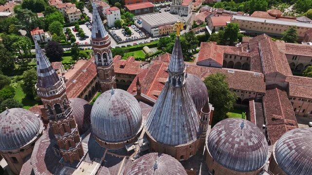 Aerial drone view of the Basilica of St. Anthony in Padua, Italy, showcasing the iconic domes, historic architecture, and surrounding cityscape of the Veneto region.