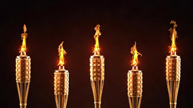 Traditional woven bamboo torches burning with bright fire, Row of burning bamboo torches with bright orange flames against dark background. Five lit bamboo tiki torches glowing with fire flames in the