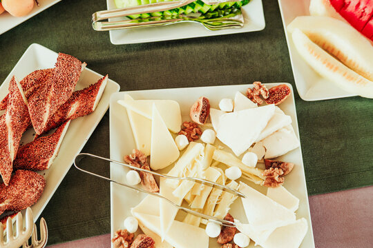 traditional turkish breakfast feast with rich variety on table photos series, cheese plate with fig and wallnuts