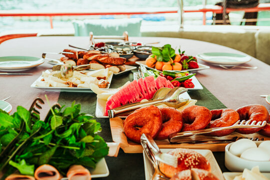 traditional turkish breakfast feast with rich variety on table served on boat gulette for holiday tourists