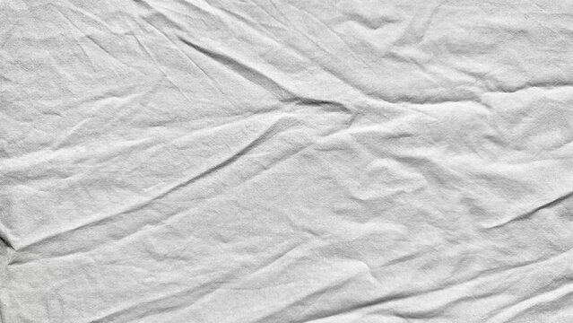 white cotton gauze fabric texture showcases minimalist organic folds in overhead flat lay clean abstract background