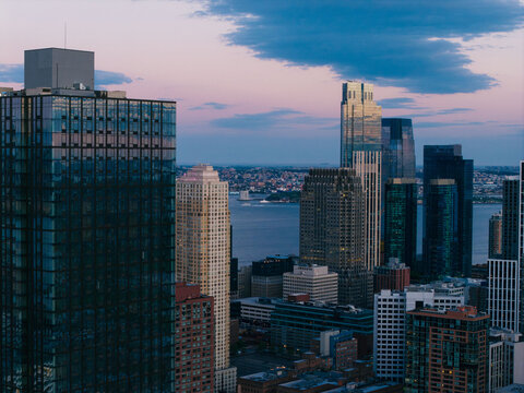 Modern Jersey City Skyline with Waterfront Towers at Dusk
