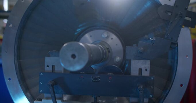 Industrial machine operating with a rotating component in a metal workshop
