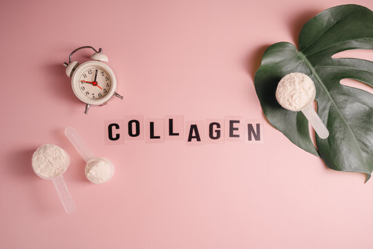 Collagen powder scoops with collagen lettering and clock on pink background, feminine beauty, food supplement background