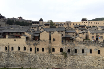 Obraz premium Ancient Chinese Fortified Village with Stone City Walls