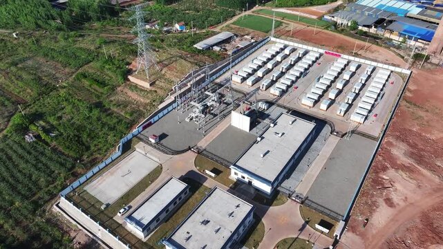 Aerial view of a large-scale energy storage power station with comprehensive facility layout and containerized battery units