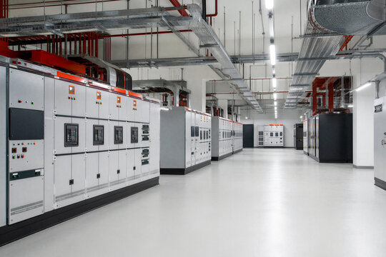 Industrial switchgear room with voltage control panels, cable trays, and clean electrical infrastructure.