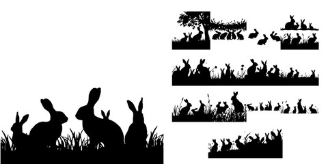 Obraz premium Group of Rabbits in a Meadow Silhouette