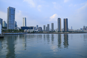 Modern city waterfront skyline with skyscrapers and reflections © PhungBao