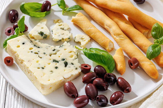 Premium blue cheese plate with grissini and olives