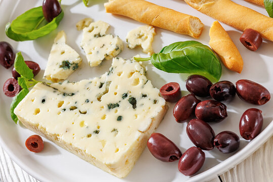 Premium blue cheese plate with grissini and olives