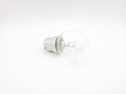 Clear Glass Incandescent Light Bulb With Bayonet Cap Base Isolated On White Background For Residential Or Industrial Lighting Projects And Energy