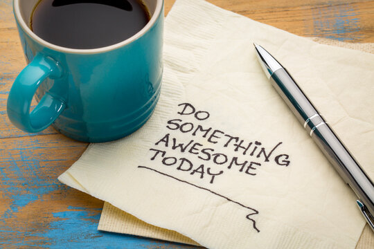 do something awesome today - inspirational handwriting on a napkin with a cup of coffee