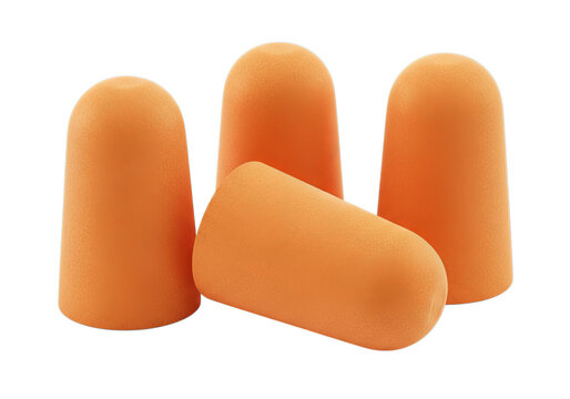 Bright orange foam earplugs for noise reduction and hearing protection in a group on a deep background