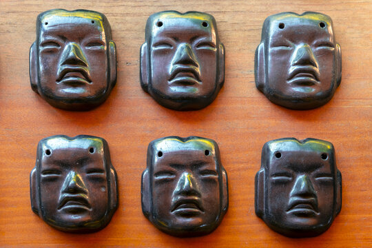Black shiny ceramic of zapotec style faces, San Bartolo Coyotepec, Oaxaca Valley, Mexico.