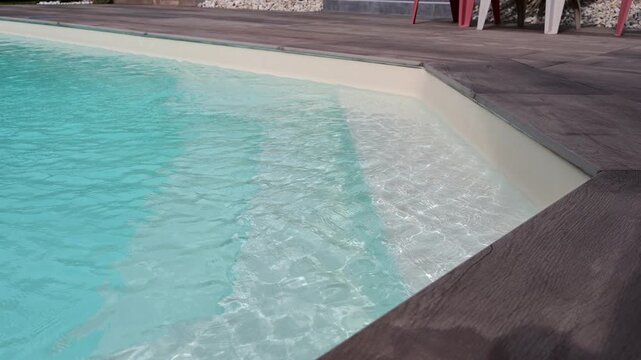 A swimming pool in France during a heatwave and the hottest day recorded in the country.
