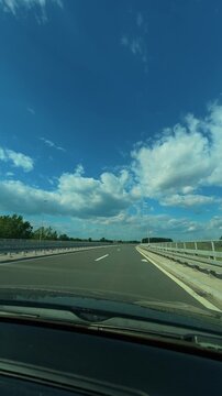 Clear sky stretches above empty road. Balkans, Serbia. Vertical