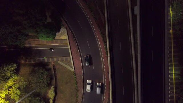 Top shot Aerial of Curved Highway Flyovber Ramp at Night in Semanggi, Jakarta