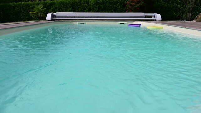 A swimming pool in France during a heatwave and the hottest day recorded in the country.