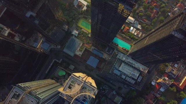 Aerial top shot drone view of the Sudirman Central Business District (SCBD) during sunrise.