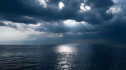 Fototapeta premium Crystal calm storm clouds reflect shimmering light over a vast and serene ocean seascape