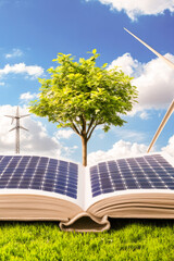 Obraz premium A book sits on a green field, perfect for educational or outdoor-themed projects vertical frame