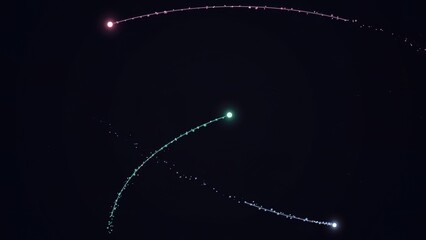 Colorful space comets with glowing tails in dark night sky © Ana