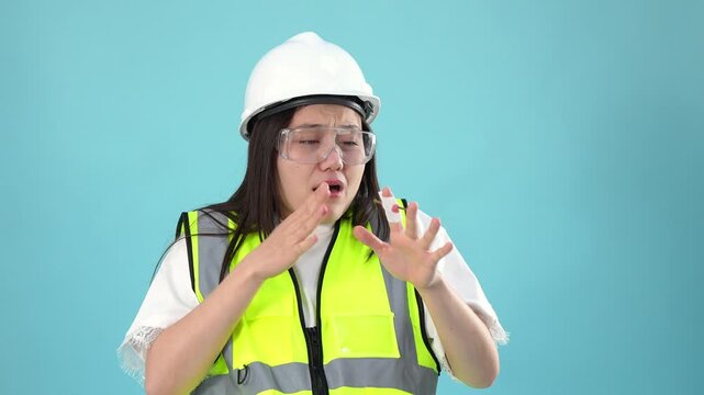 Shocked female engineer looking at fake finger injury prank