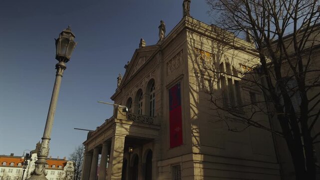 Establishing shot of Prinzregententheater venue in Munich Germany, showing the grand portico entrance of the opera house that features a Bayreuth inspired auditorium inside.
