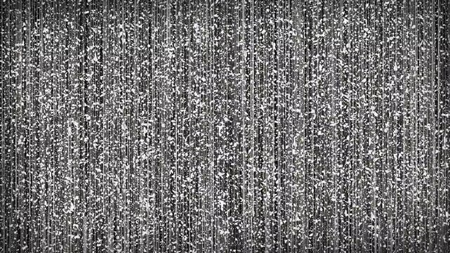 Old damaged tape with grainy tv signal noise pattern. Suitable for retro, vintage, or technology concept backgrounds or designs.