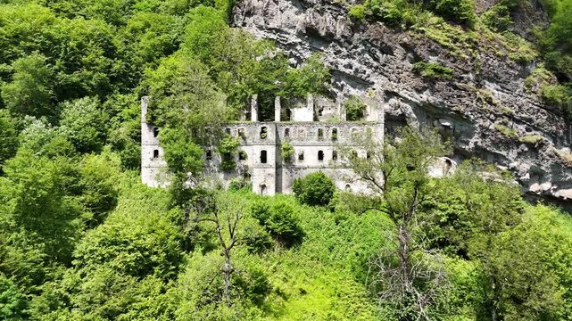 Aerial drone shot of ancient Byzantine Vazelon Monastery ruins on a cliff side in forest, Trabzon, Black Sea region, Turkey