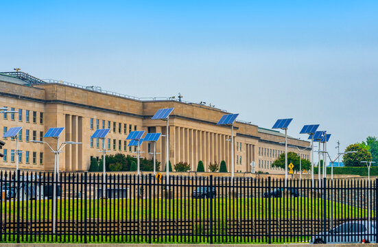 Pentagon exterior with stone columns. Pentagon federal defense building. Pentagon official government site. Pentagon security fence closeup.