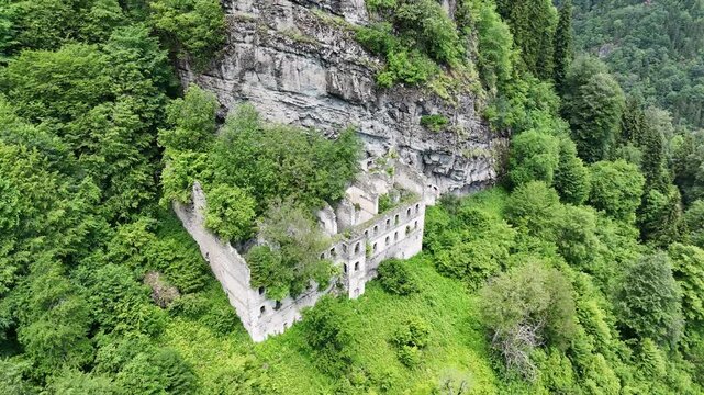 Aerial drone shot of ancient Byzantine Vazelon Monastery ruins on a cliff side in forest, Trabzon, Black Sea region, Turkey