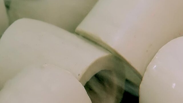 Observe pristine white ceramic elements, vital for powerful hydro filter. These components diligently work to cleanse and purify air, creating healthier environment within industrial plant today.