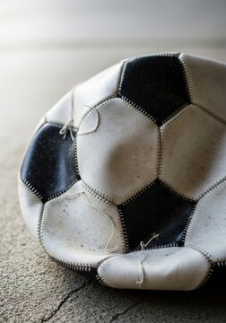 Close up of a deflated soccer ball from 146
