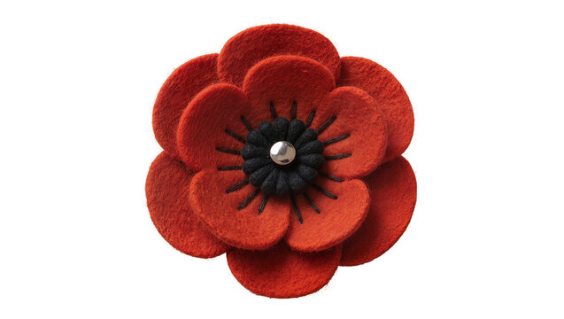 Isolated red felt poppy flower with black center and silver bead, symbol of remembrance and peace