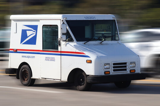 USPS Delivery Truck in Motion During Everyday American Mail Route