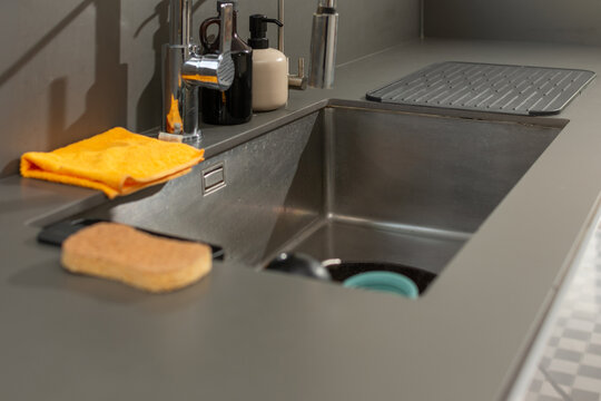 Modern kitchen sink with faucet and dish drying rack