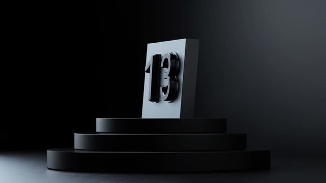 Glossy black number 13, mounted on a block atop a three-tiered, circular pedestal